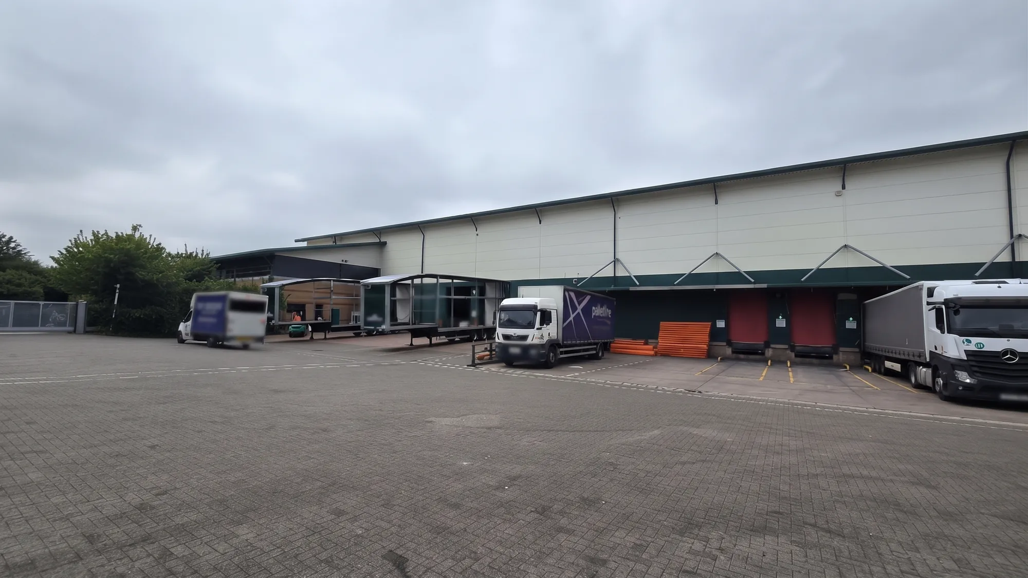Side elevation of the industrial warehouse looking along the loading bays and service yard