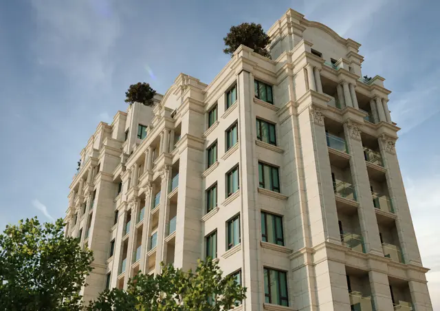 CGI of the building from below with balconies and a roof terrace