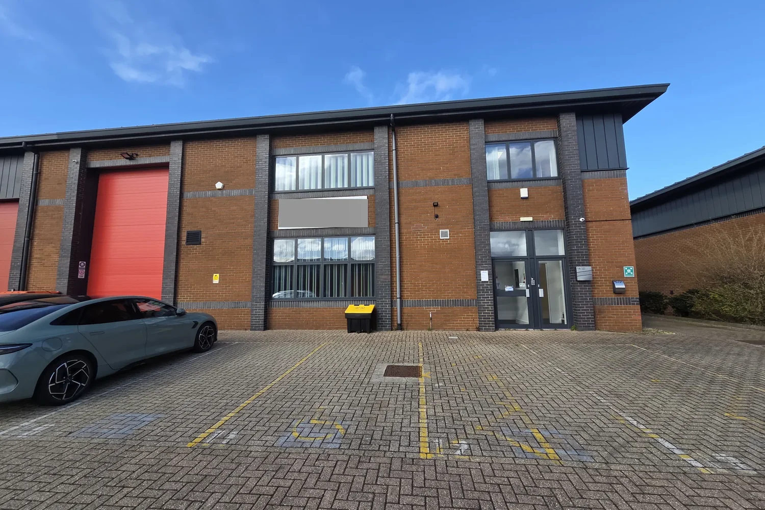 Front of a two-storey brick-built industrial and office unit in Bristol, surveyed to record what is actually on site